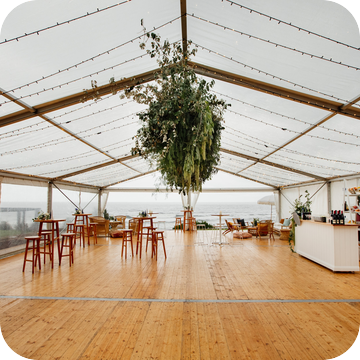 Clear Marquee Hire with Wooden Flooring by Event Marquees | © Event Marquees