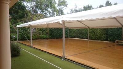 marquee on a tennis court by event marquees