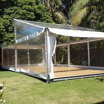 clear marquee with wooden floor hire by event marquees | © event marquees
